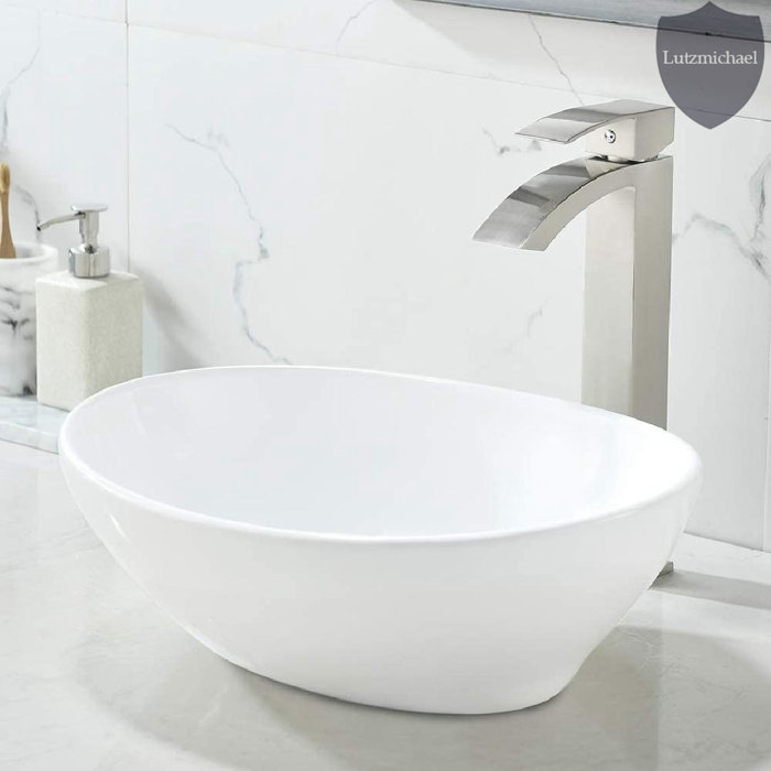 Menggutong 13'' White Ceramic Oval Vessel Bathroom Sink with Faucet